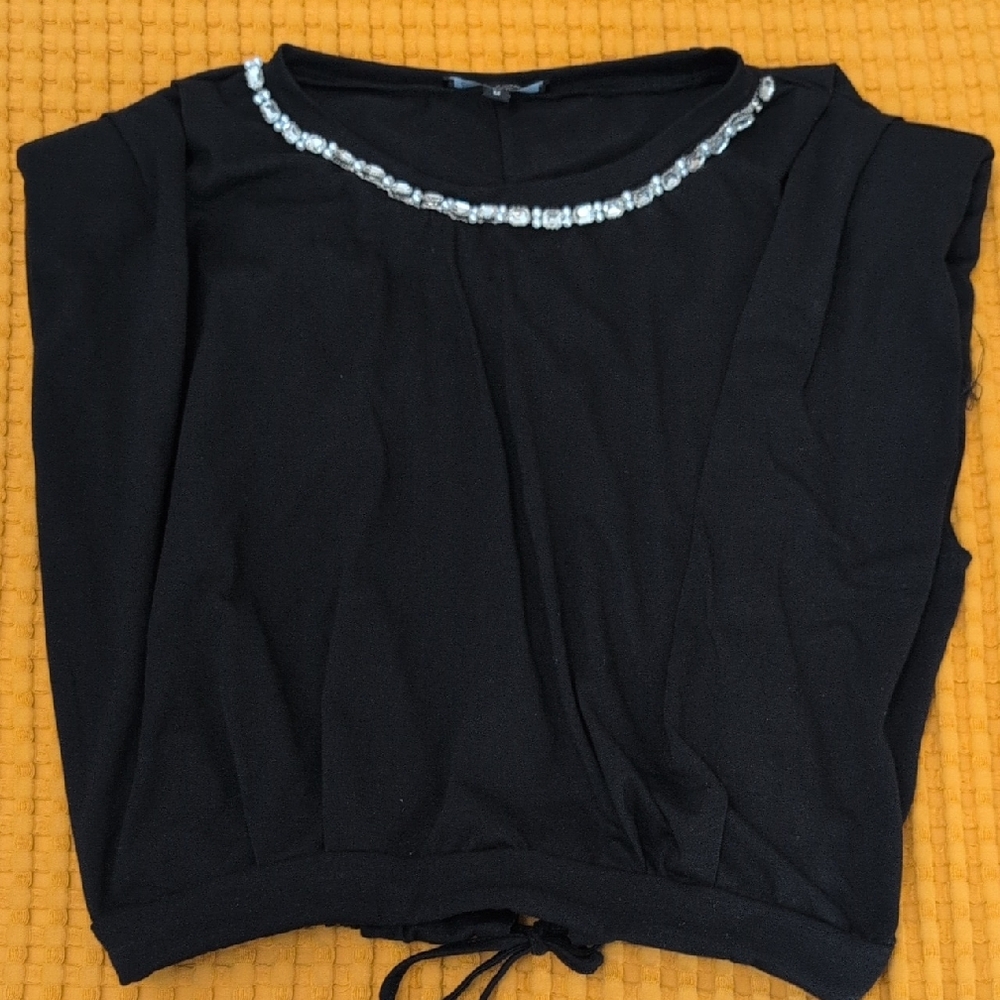 Elegant Black Blouse with Diamond Neckline